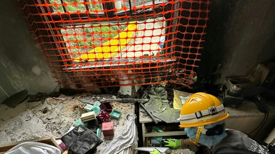Photos, clothes, ashes: Hongkongers pick through fire-ravaged homes