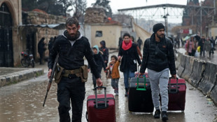 Syrian army says swept Aleppo district after clashes with Kurdish fighters