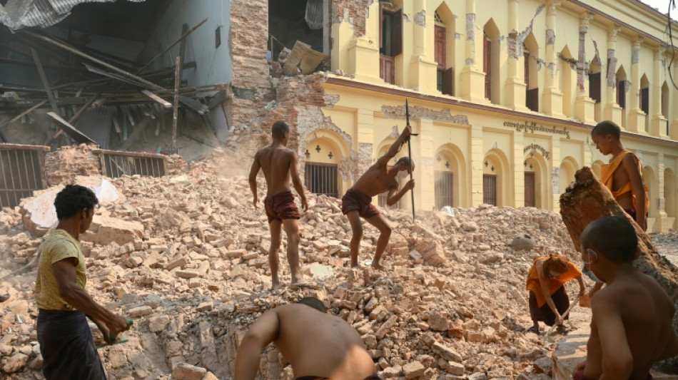 Like 'living in hell': Quake-hit Mandalay monastery clears away rubble