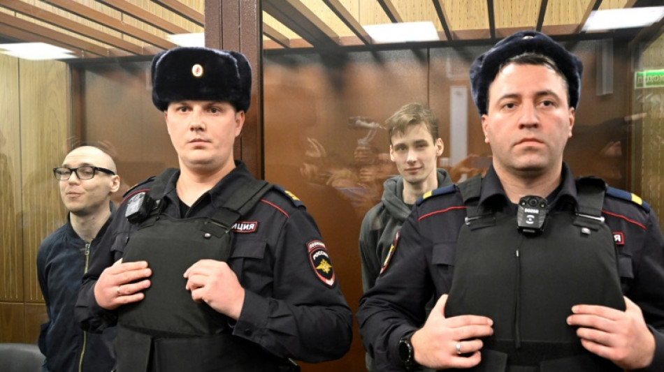 Two Russians get prison terms for poetry against Ukraine campaign